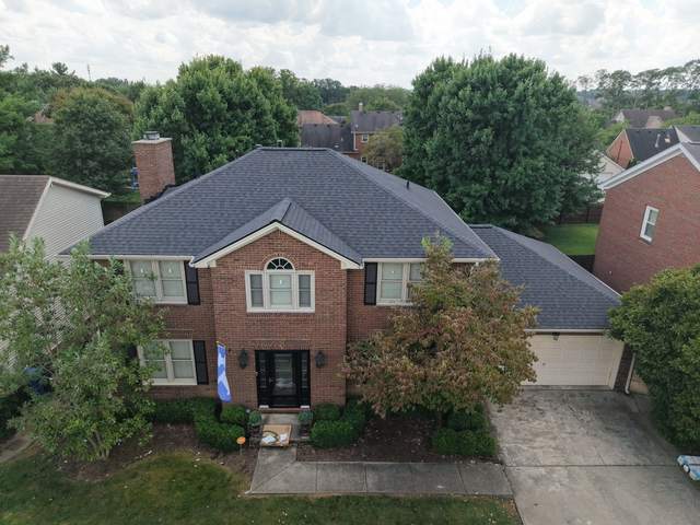 After: the same home with a new charcoal shingle roof