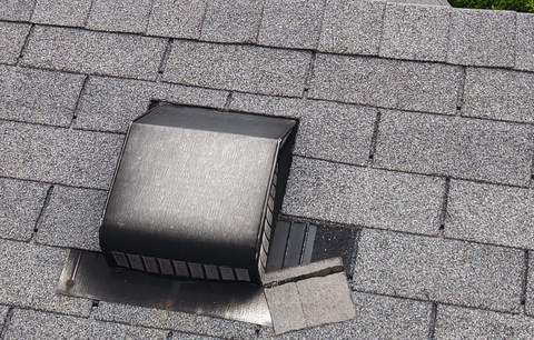 Old box vent on the worn roof, photographed at inspection